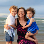 Meghan Doyle with her children on a beach