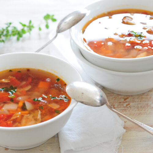 Postpartum chicken soup recipe with ginger, carrots, celery, shredded chicken, and herbs